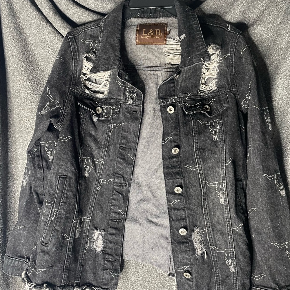 It’s a cute western jacket. Never worn no holes or anything.